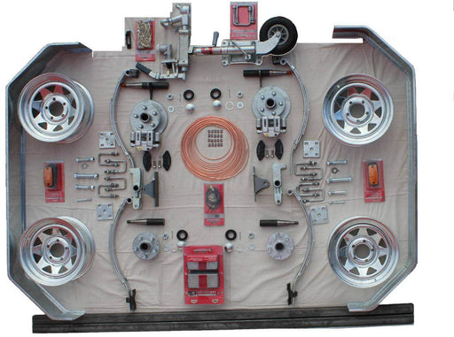 2250kg Tandem axle braked trailer 14" Kit parts and components layout on a table.
