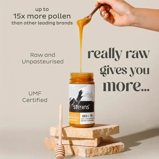 UMF 10+ Raw Multifloral Manuka Honey 500g in a jar with honey drizzling, showcasing premium quality and benefits.