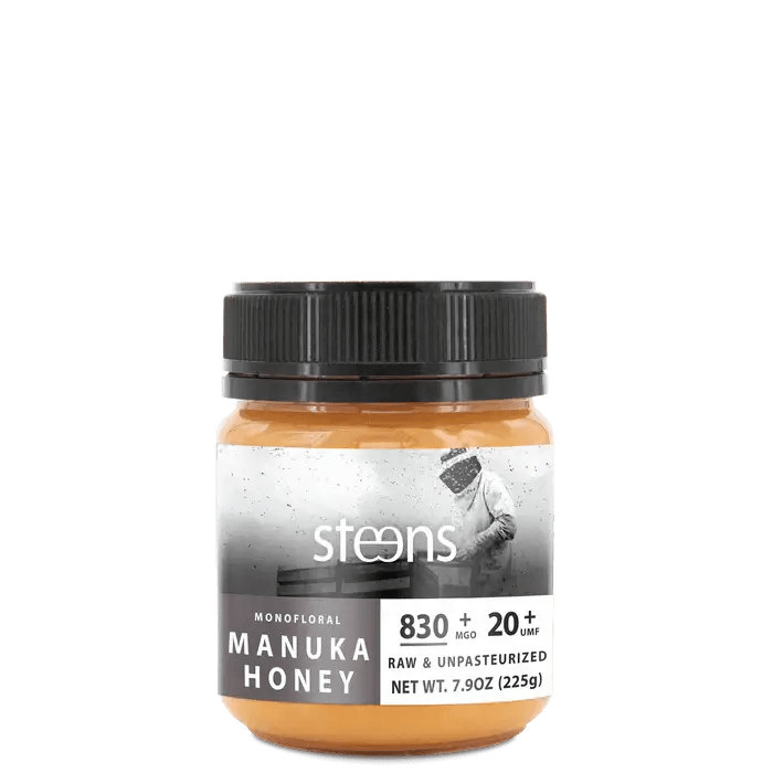 UMF 20+ Raw Multifloral Manuka Honey 225g jar with black lid and label showing nutritional information.