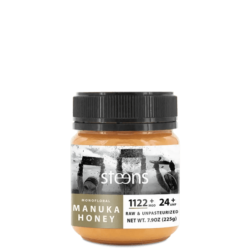 UMF 24+ Raw Multifloral Manuka Honey 225g jar with label showing potency and details.