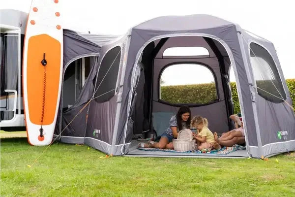 Vango HexAway Air tall awning - Drive Away featuring a family enjoying their time outside a campervan.