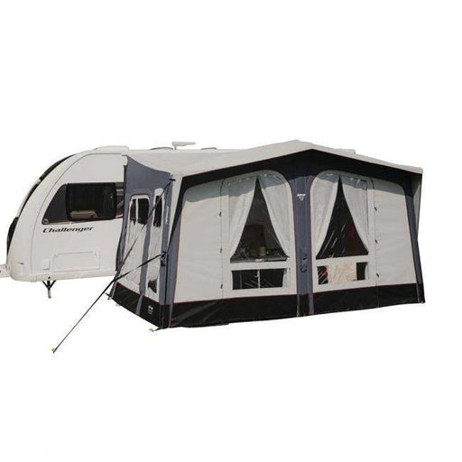 Vango Riviera Elements 330 Awning With Carpet attached to a caravan, showcasing durable fabric and classic design.