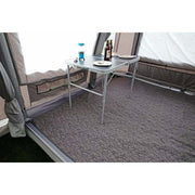 Insulated Carpet-Kela 2.20 x 3.0m RVF4520 shown inside an awning with a table and drinks.