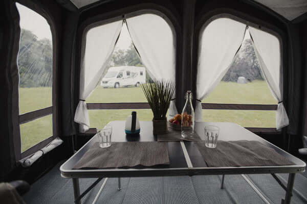 Interior view of the Vango Riviera 390 Awning Elements Pro Shield showcasing a dining area and windows.