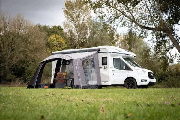 Vango Sunlight Air 380 Elements Proshield awning setup next to a campervan in a scenic outdoor setting.