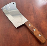Victory Kitchen Cleaver 2-229-18-120WD with a stainless steel blade and wooden handle on a wooden surface.