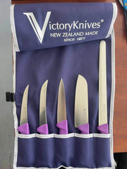 Purple Food Prep Knife Set displayed in a 5-pocket knife wrap with vibrant purple handles.