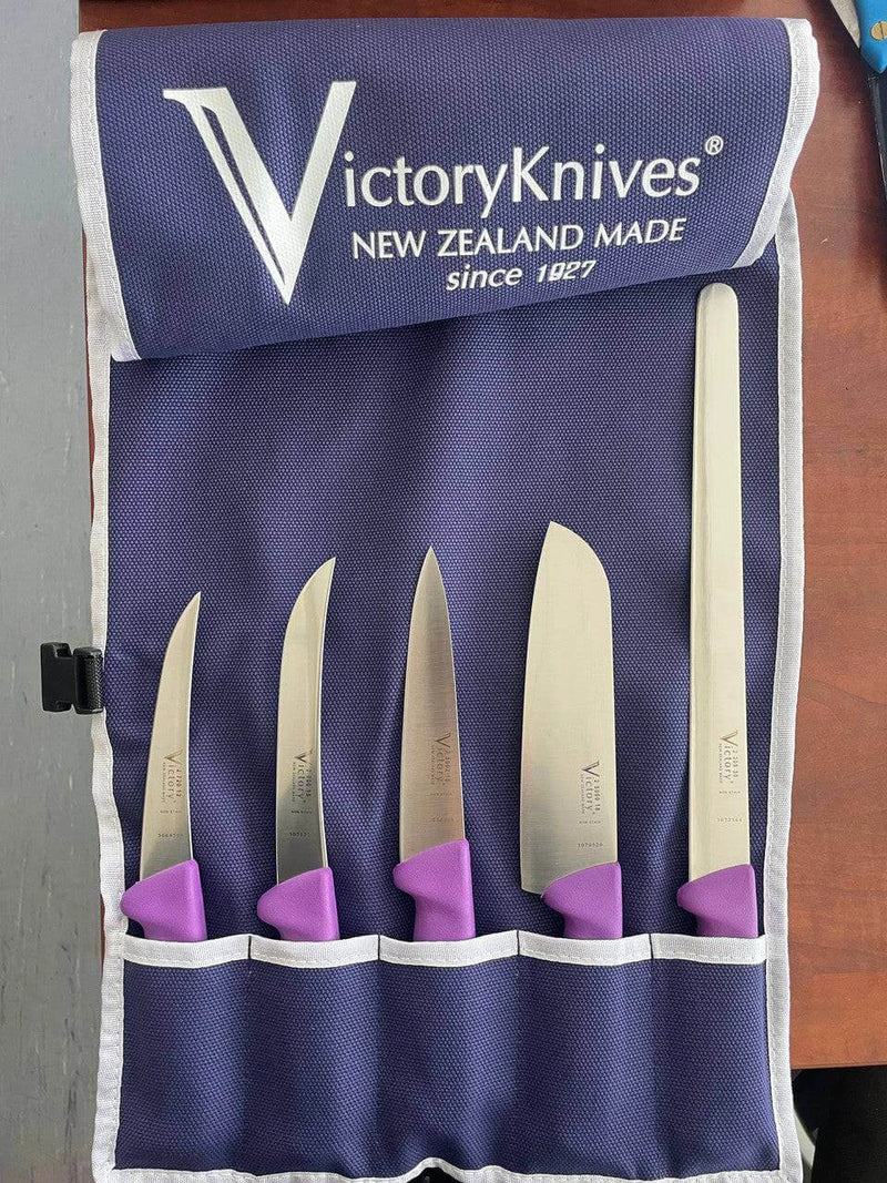 Purple Food Prep Knife Set displayed in a 5-pocket knife wrap with vibrant purple handles.