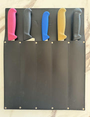 Victory Knife Safe with different colored knife handles safely stored in a leather holder.