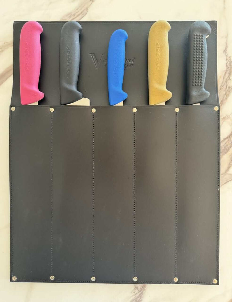 Victory Knife Safe with different colored knife handles safely stored in a leather holder.