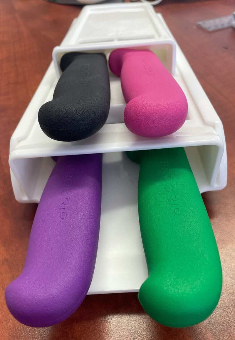 White Quad Knife Scabbard SK10/4 -  S17 displayed with colorful knife handles for organization and storage.